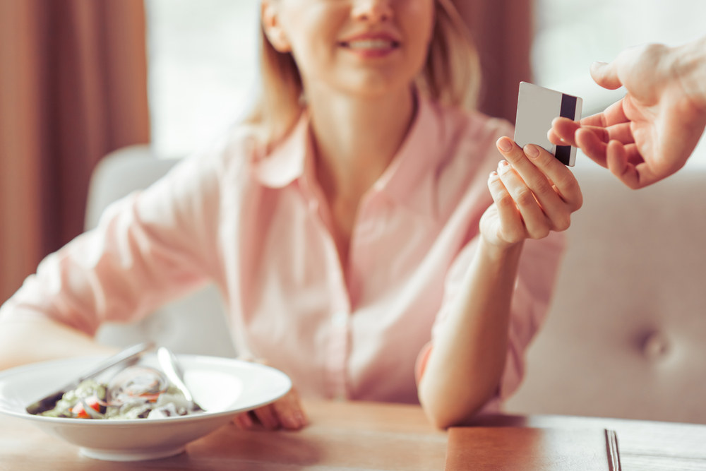 Woman paying with credit card